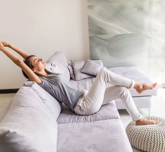 young woman enjoying the benefits of air purification