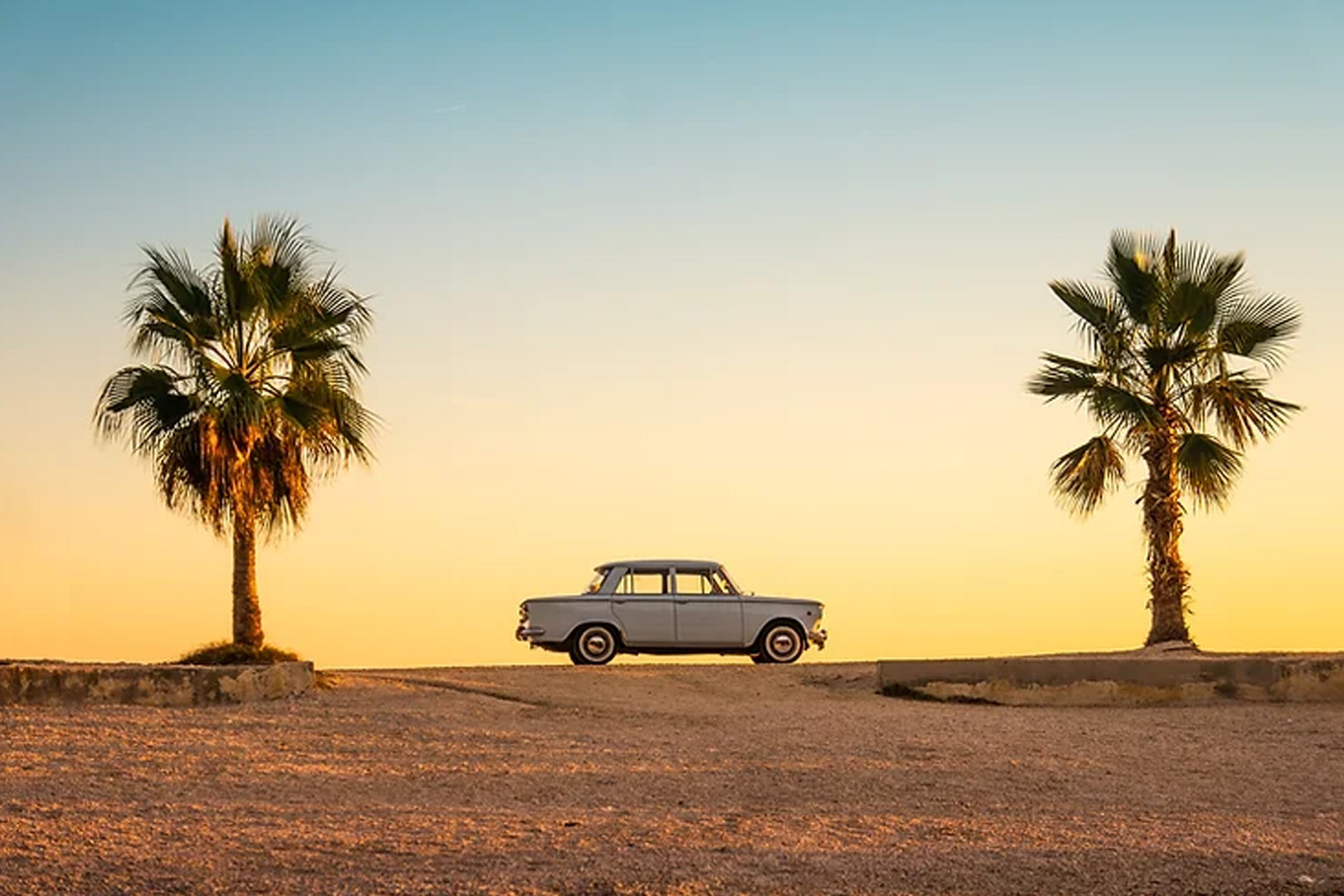 classic car in tropical location depicting summer