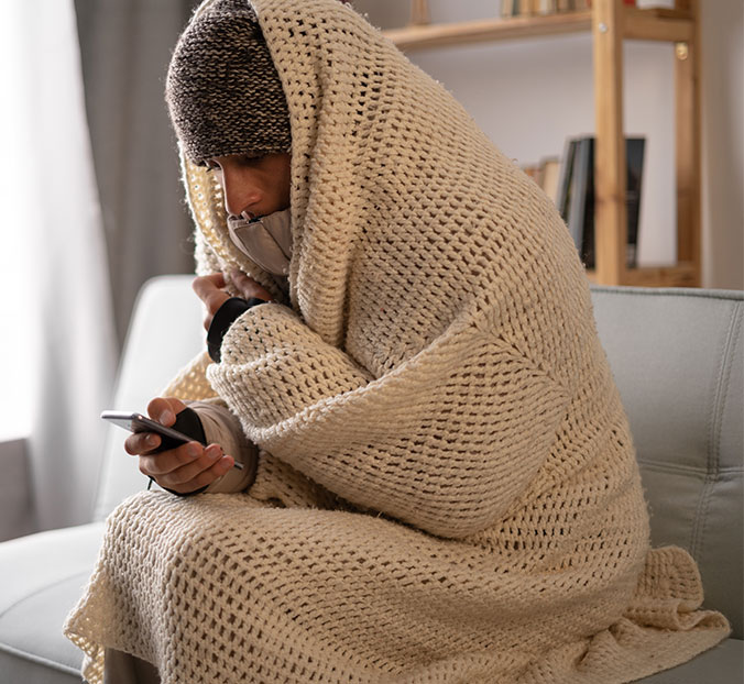 woman dialing emergency services for heating loss